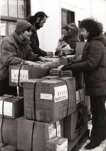 People packing aid supplies.