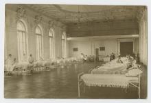 Patients and nurses in an infirmary.