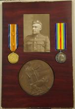 Memorial collage, medals and photograph of David Elliott.