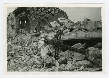 Bombed church with an intact cross amongst the ruins. 